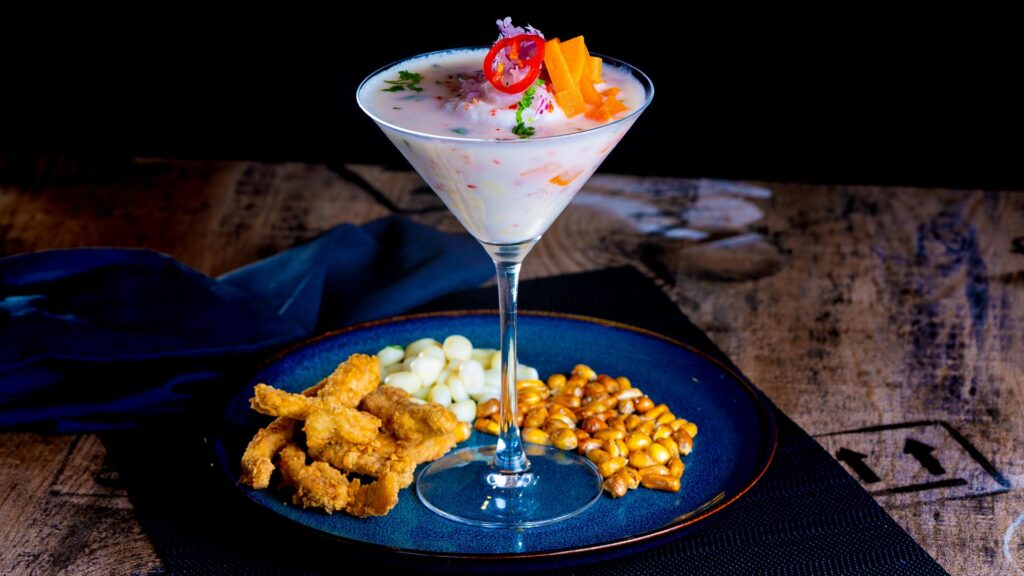 glass of Leche de Tigre, the potent citrus marinade from Ceviche.