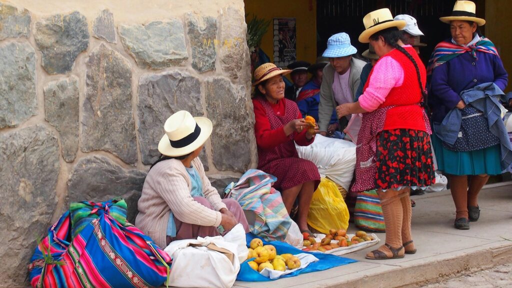 Women selling potatoes and vegetables in peru