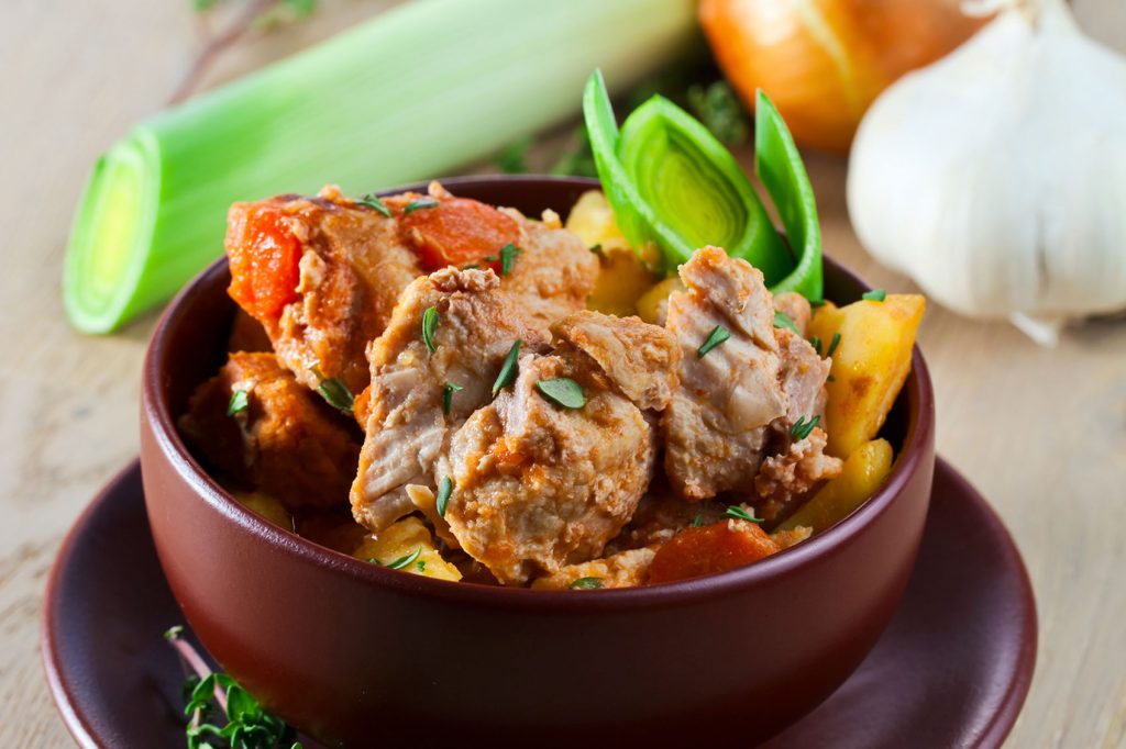 Chicken stew in a bowl with potatoes and onions, inspired by the Taste of Ireland.