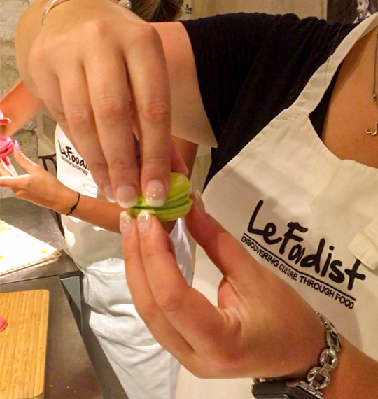 In a kitchen, a woman is preparing a dish before she travels.