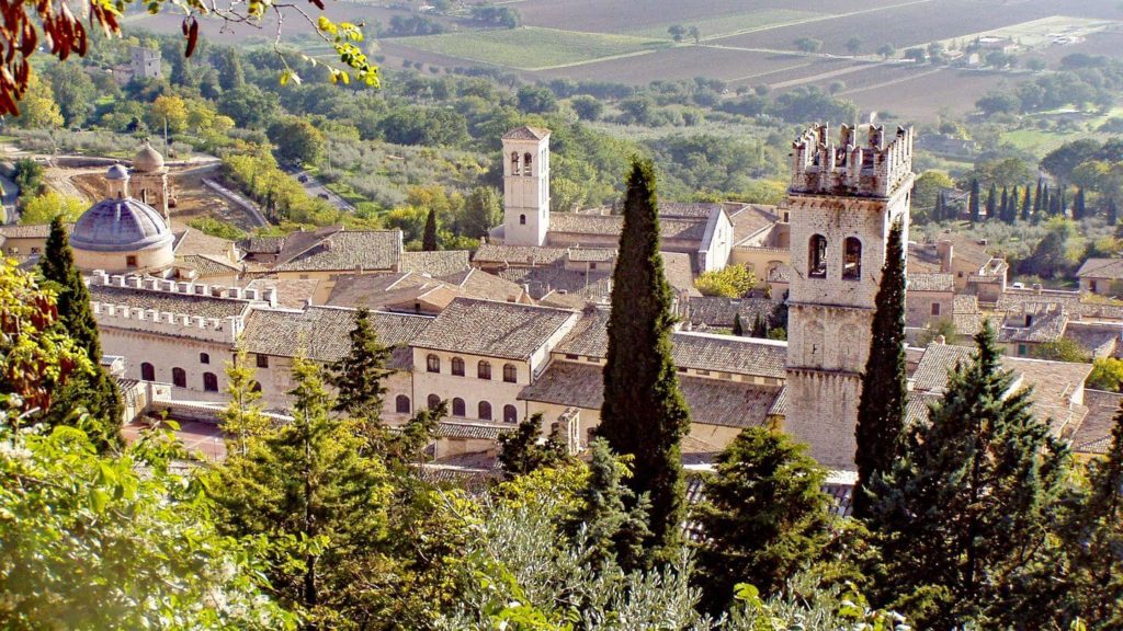 A view of a town with trees and a church, perfect for Christian tours or church group travel.