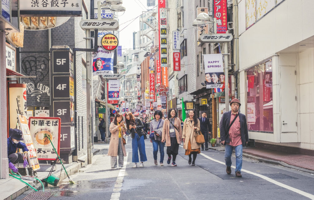 girls shopping on street in Asia