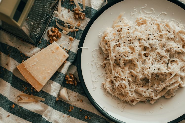 creamy pasta with block of cheese Tuscan dishes