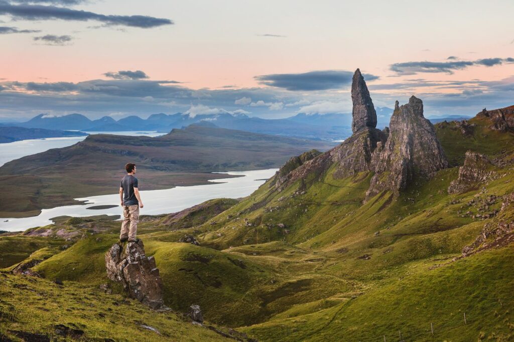 man looking over the Scottish Highlands