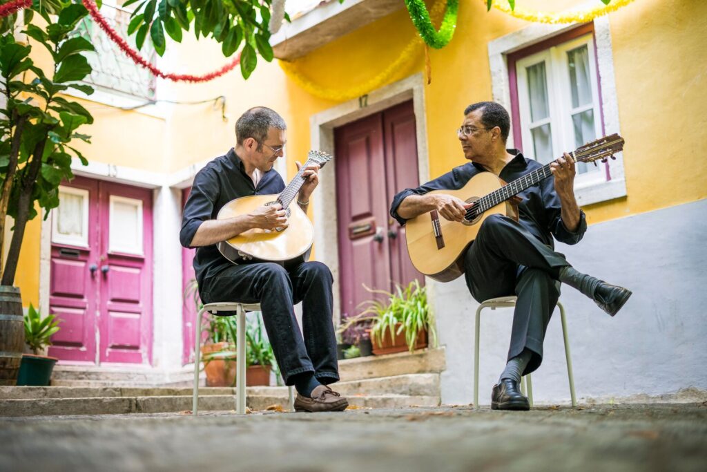 Two men playing guitar in Portugal