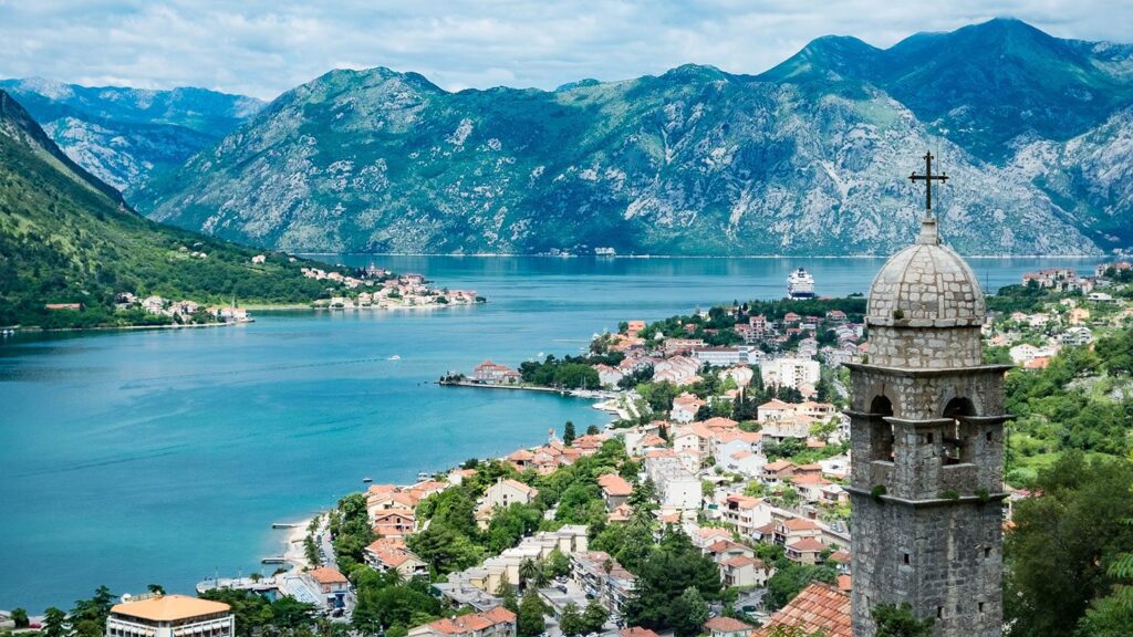 The Bay of Kotor in Montenegro, with a church steeple in the foreground