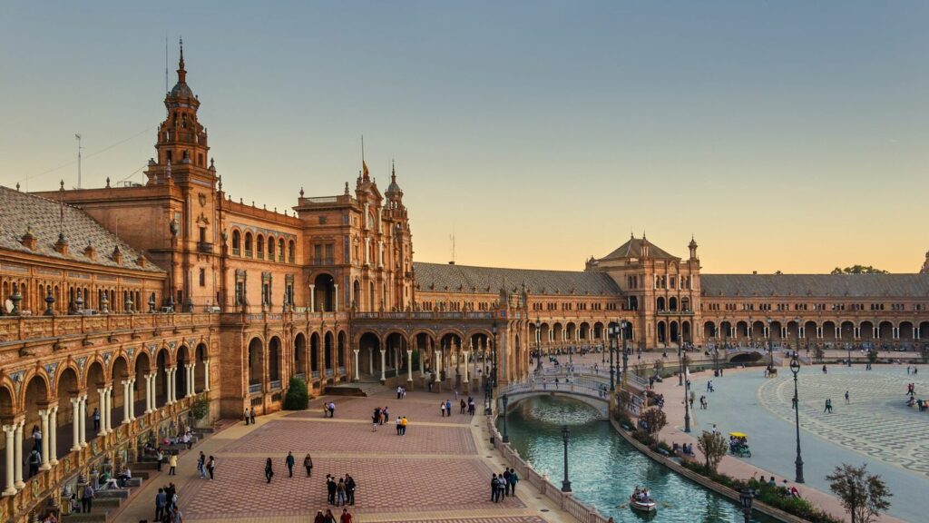 A wide angle view of Plaza of Espana in Seville at golden hour