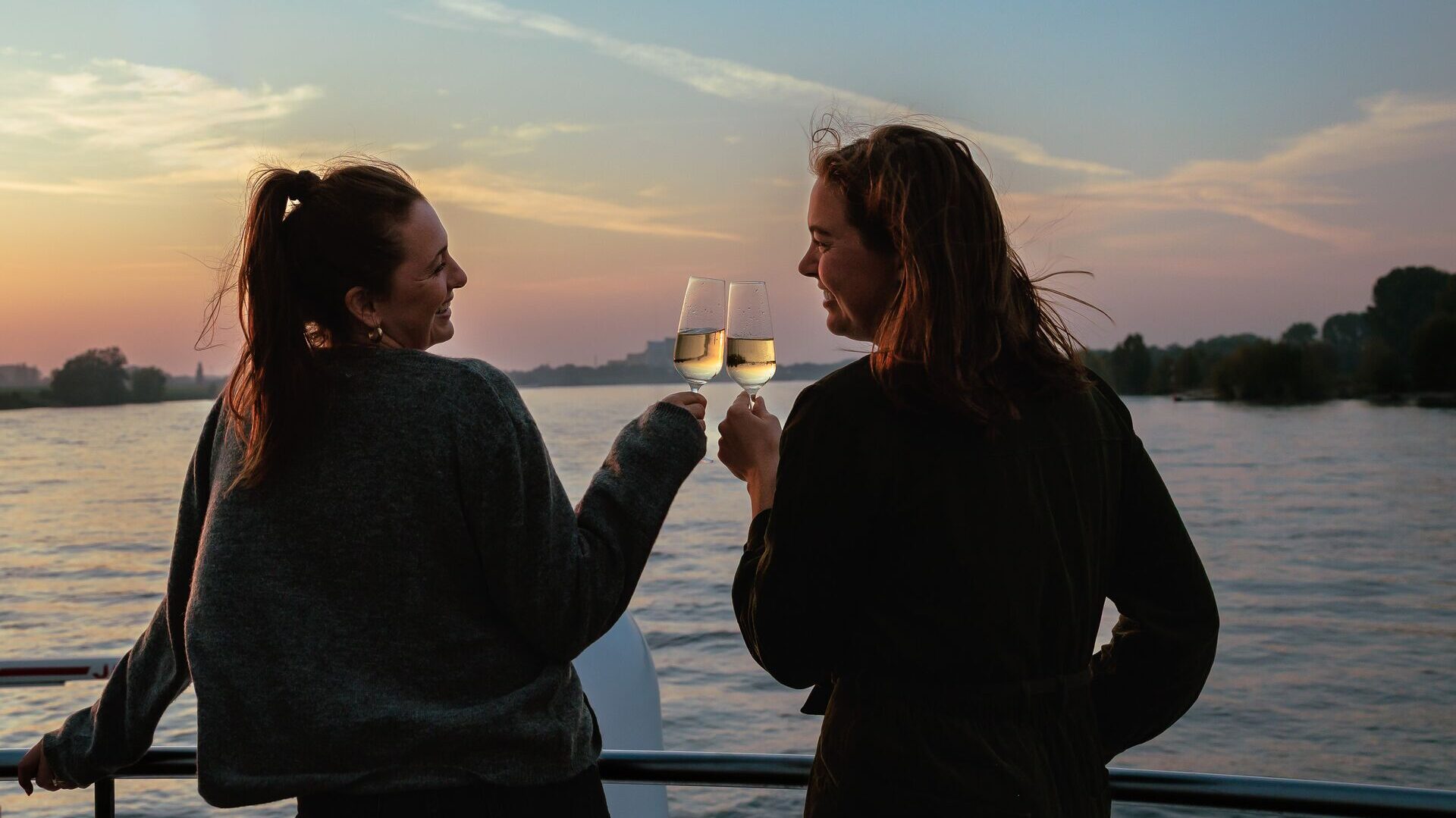fizz at sunset on deck on a trafalgar rhine river cruise
