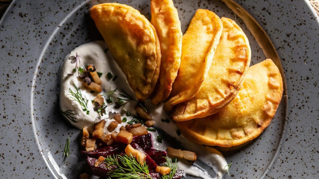 Varenyky are pierogi’s Ukrainian cousins. Traditionally filled with potatoes, cheese, cherries or cabbage