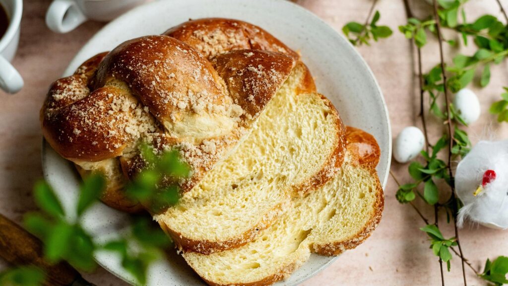 top-down view of a braided cake, sliced on a plate