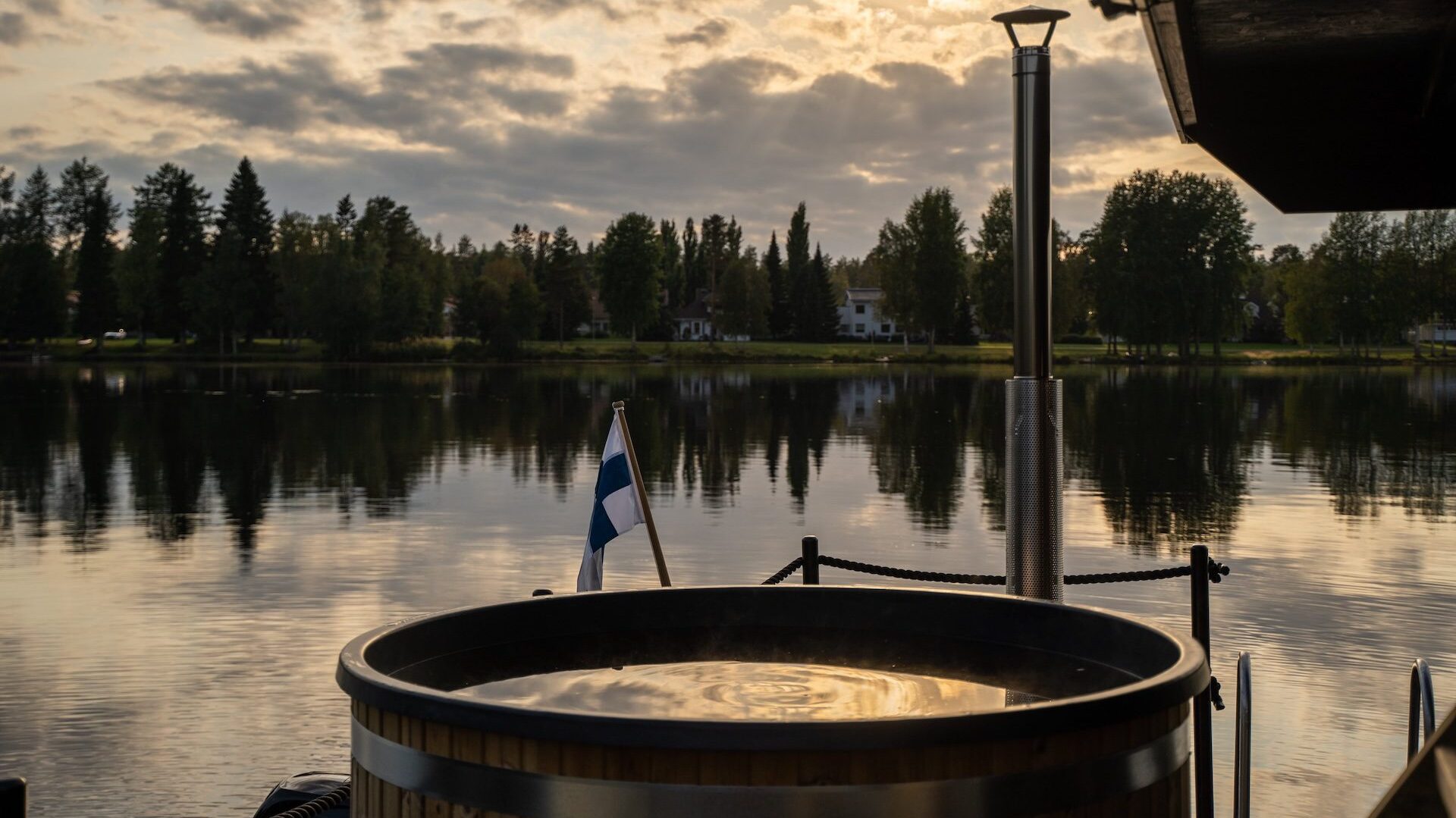 an oulu sauna raft overlooking a lake