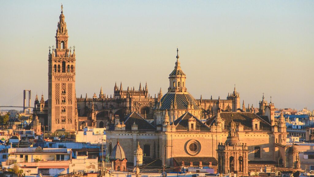 Skyline view of Seville's Gothic Cathedral at sunset