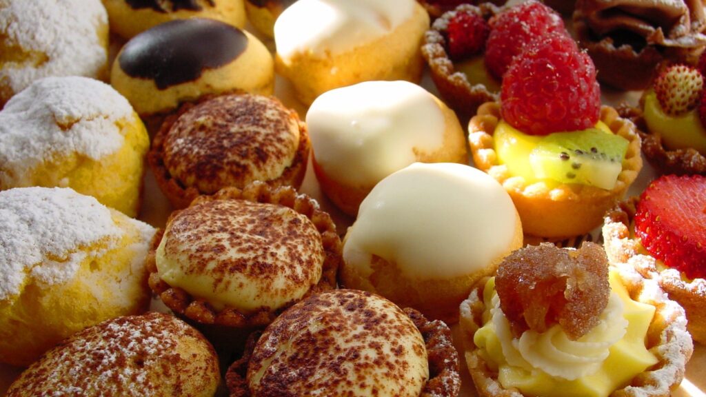 Close up of small cakes and desserts
