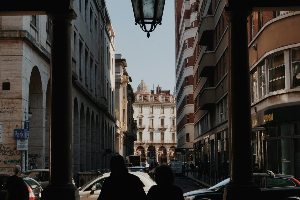 Silhouettes of people with view of a street in the background