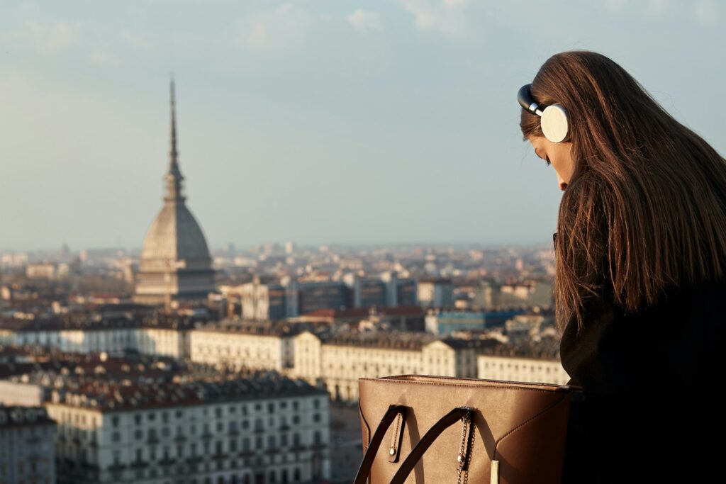 Woman sitting overlooking a view of Turin