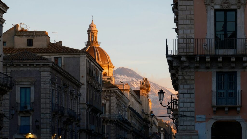 Mountain in the backdrop, looking over a street in Turin