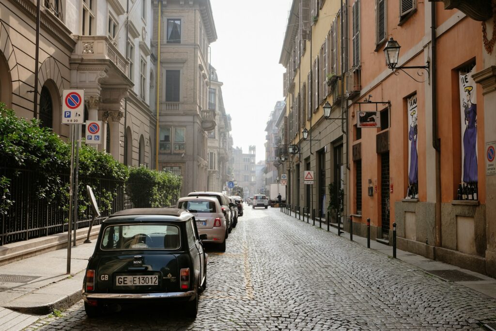 Cars parked along the side of a street 