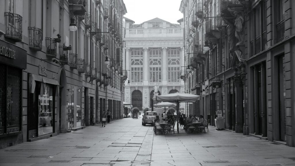 black and white photo of an empty street in Turin
