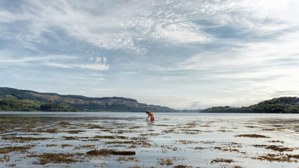 Woman in water in Scotland