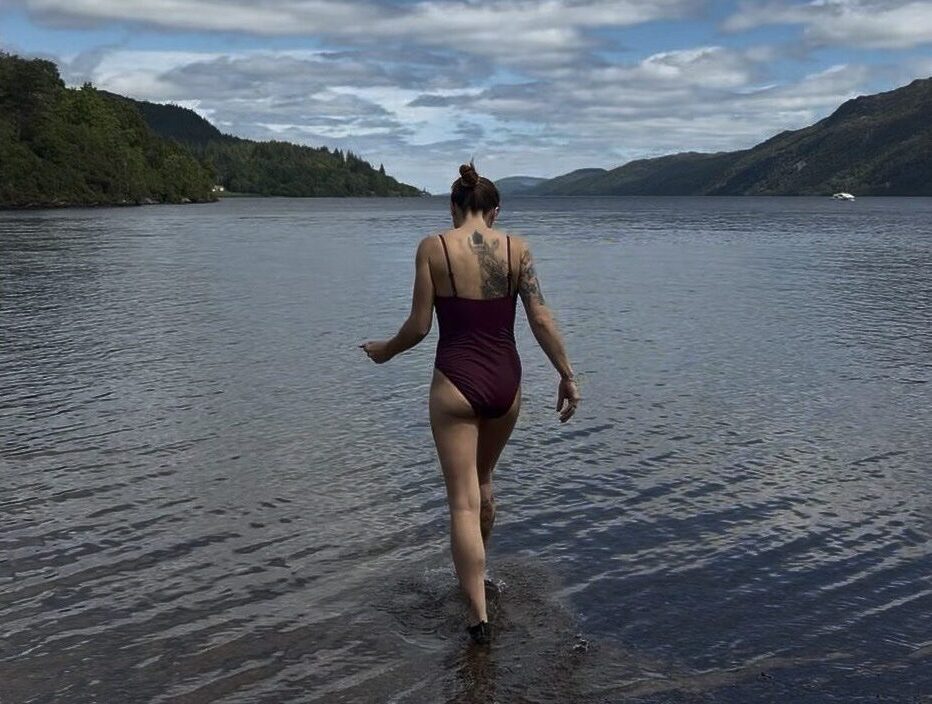 Fiona in Scotland getting into a Loch
