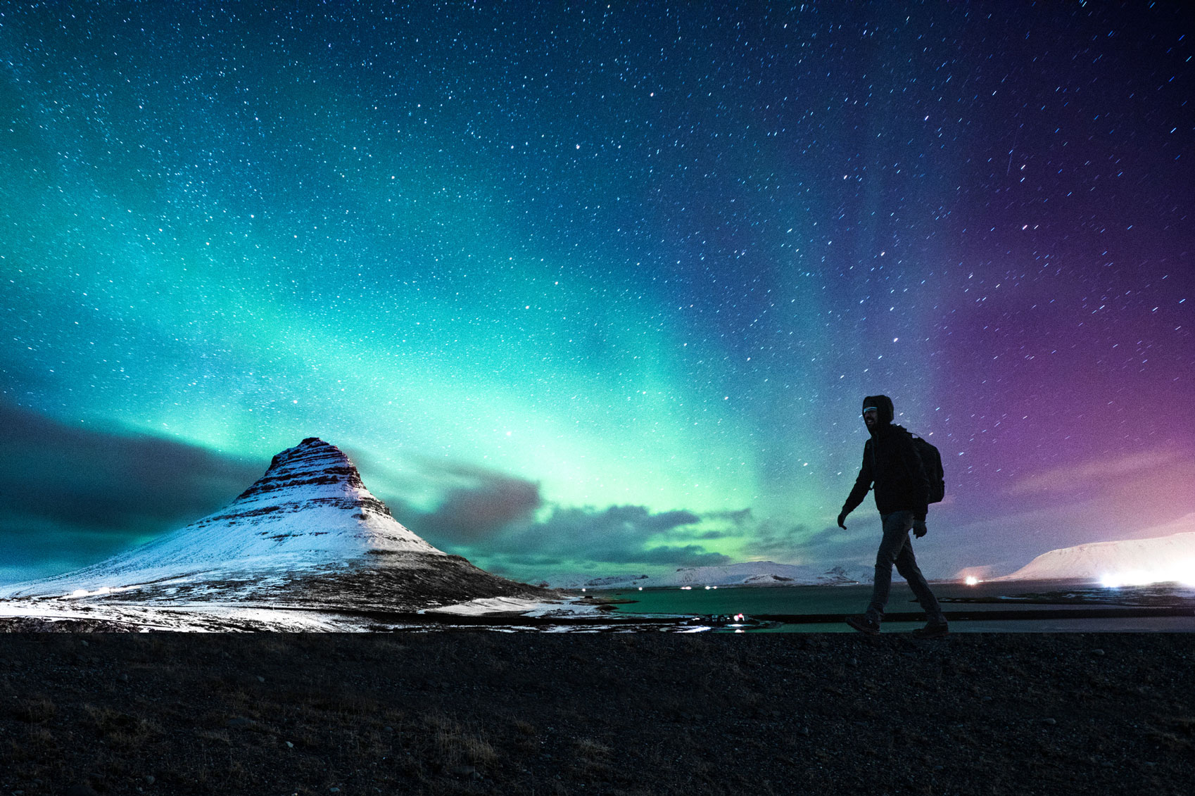 Iceland know before you go Northern-Lights-Mount-Kirkjufell-Iceland-www.istockphoto.comgbphotonorthern-lights-in-mount-kirkjufell-iceland-with-a-man-passing-by-gm663261182-120800457-LeoPatrizi
