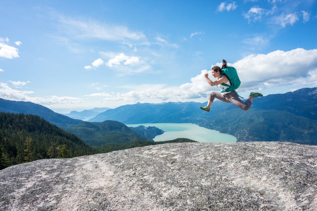 Solo travel destinations Young-Woman-Hiker-with-Backpack-www.istockphoto.comgbphotoyoung-woman-hiker-with-backpack-jumping-on-wilderness-mountaintop-canada-gm517407918-89470425-PamelaJoeMcFarlane