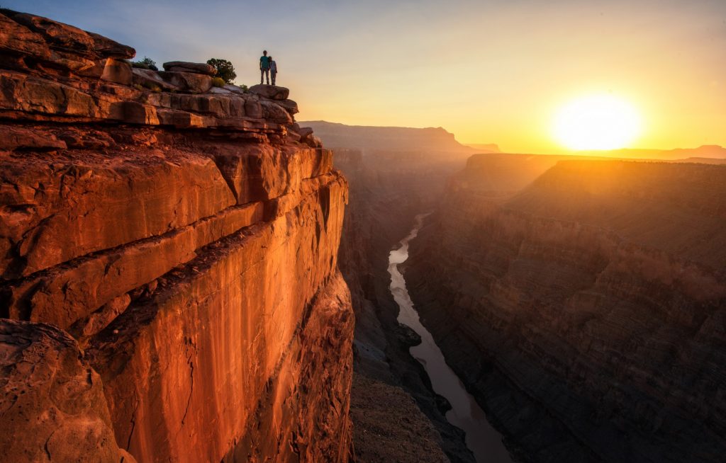 couple standing at the edge of Grand Canyon National Park