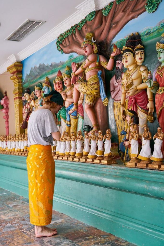 tourist praying at temple Thailand