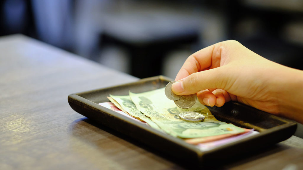 Person leaving a tip