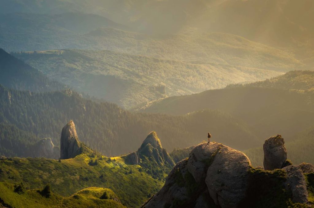 man standing on rock