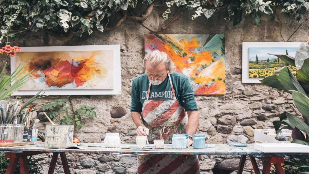 man painting outside