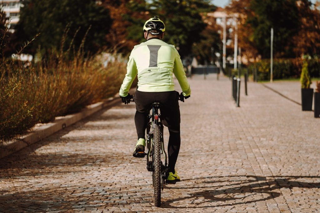 Man cycling on path