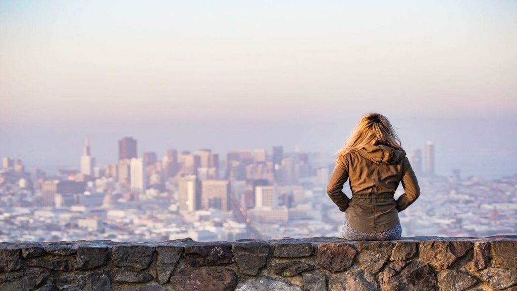 woman looking over san francisco city domestic travel