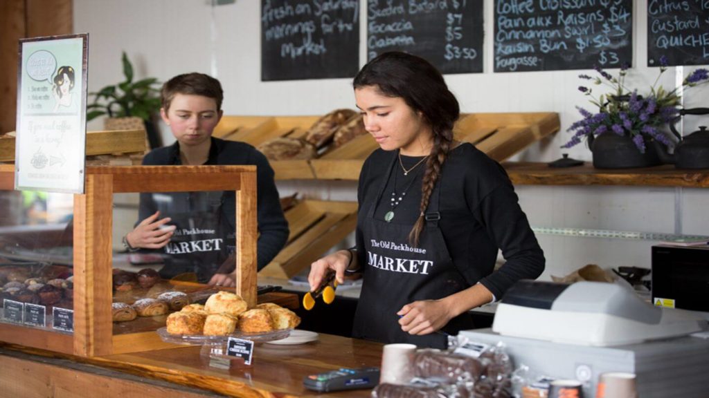 two people working at a bakery in the Old Packhouse Market New Zealand