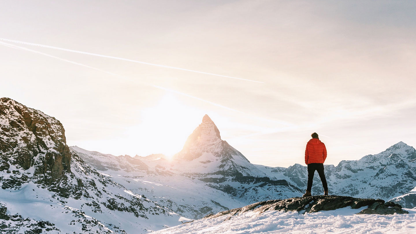 Man Standing on a summit in Zermatt