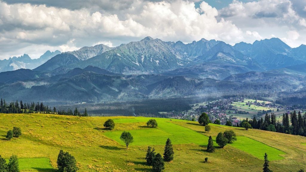 green fields and mountains of Zakopane Poland Christian tours