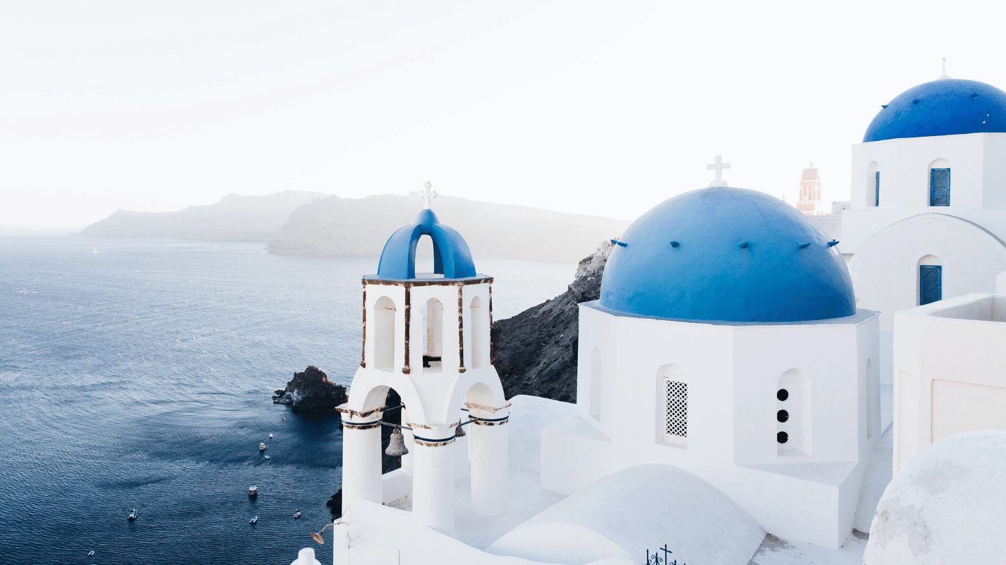 restart travel deal - blue domes of Santorini