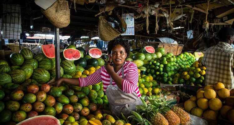 Kenyan woman in Nairobi fruit market Swahili phrases