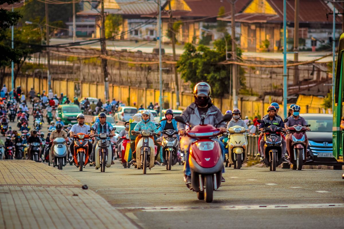 Crossing The Road In Vietnam Stock Photo - Download Image Now