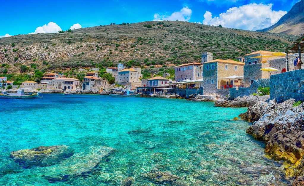 crystal blue sea stone houses Peloponnese trip to Greece