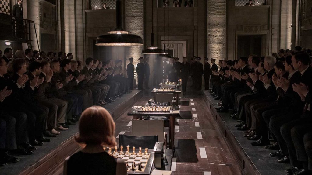 Beth Harmon playing chess in Russia.