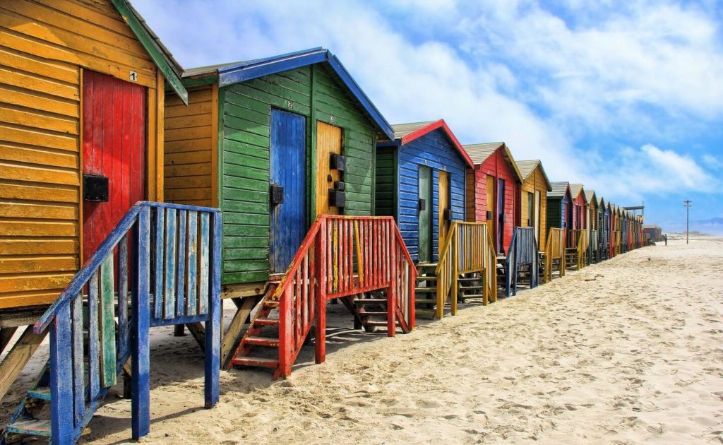 colourful beach boxes on the sand South Africa