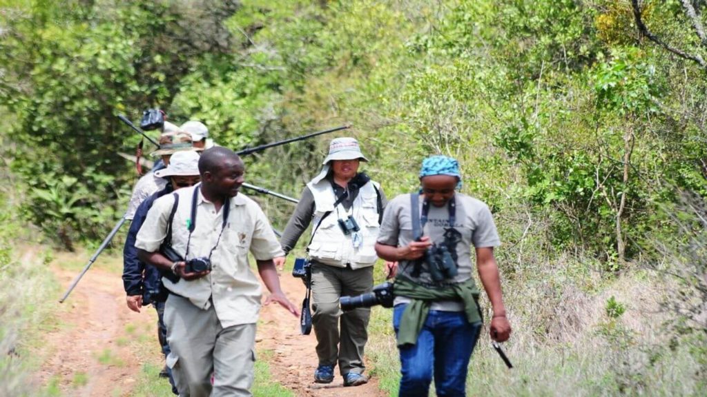 Dedan Masaai safari guide with travellers
