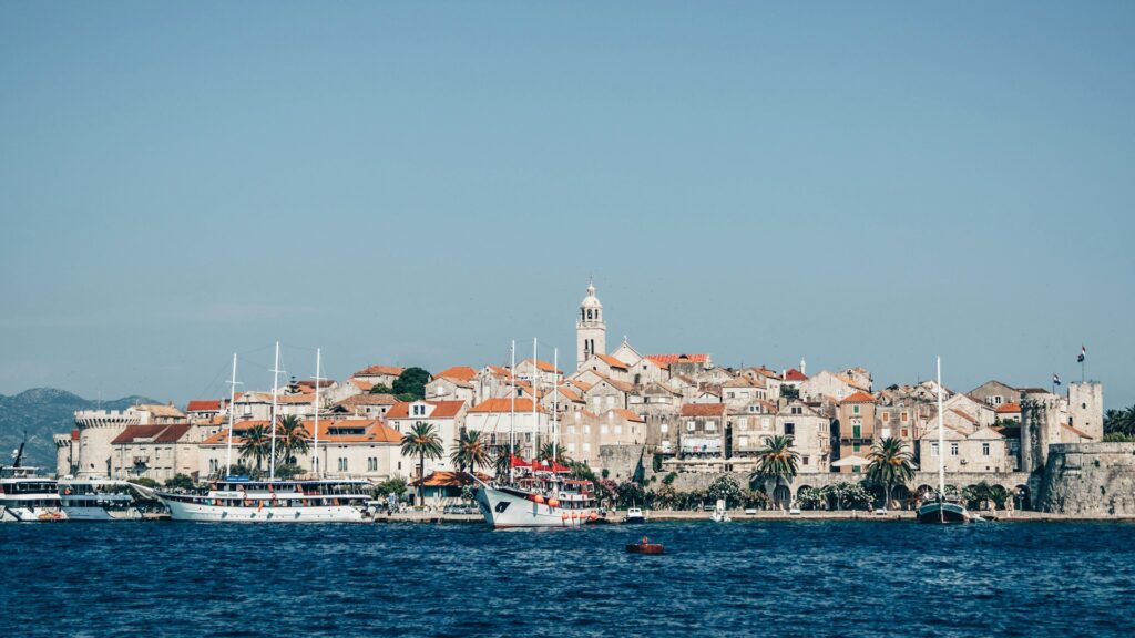 Korcula seen from across the water with boats in the foreground