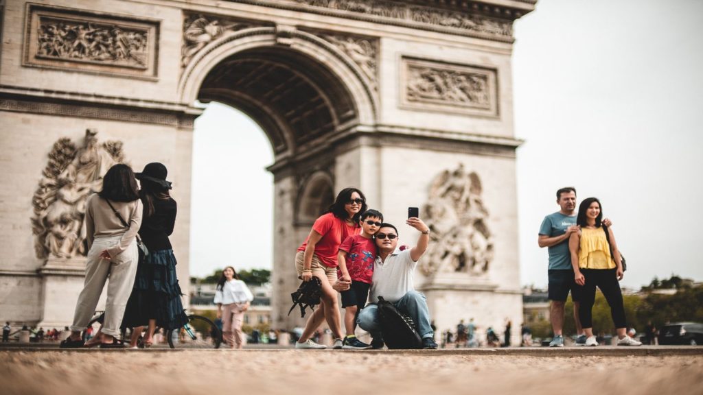 family taking a photo in Paris
