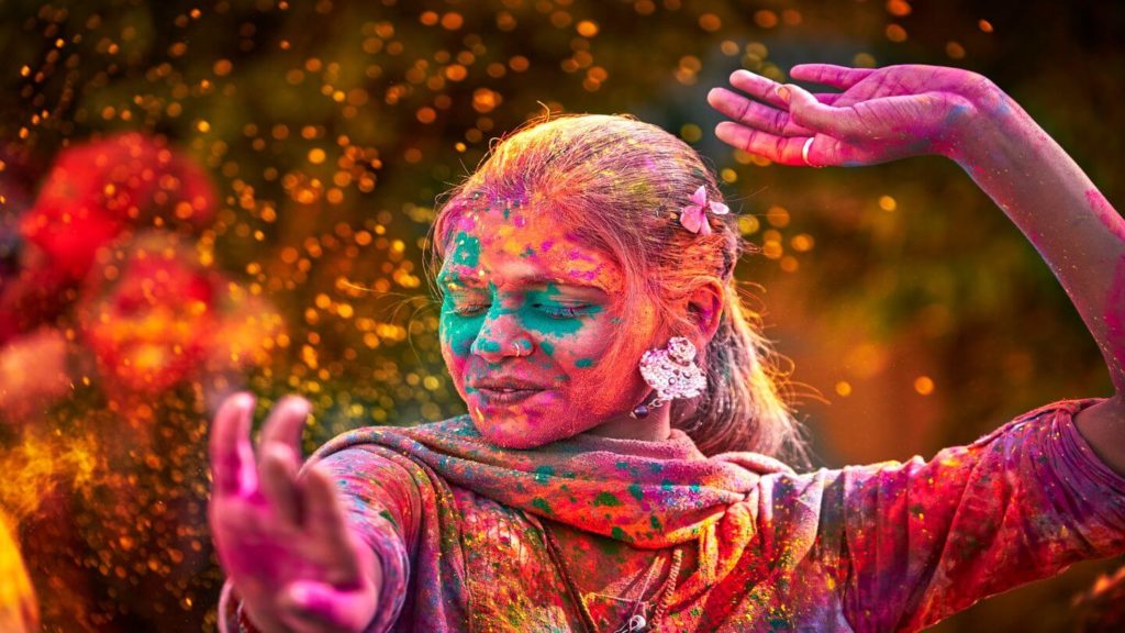 woman covered in colourful powder holi festival
