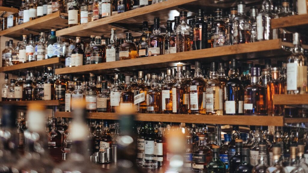 bar shelves full of alcohol bottles