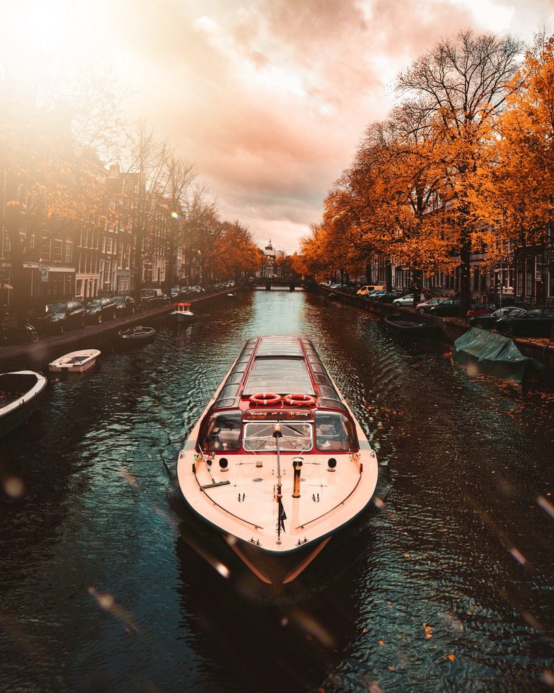 river boat cruising through Amsterdam canals