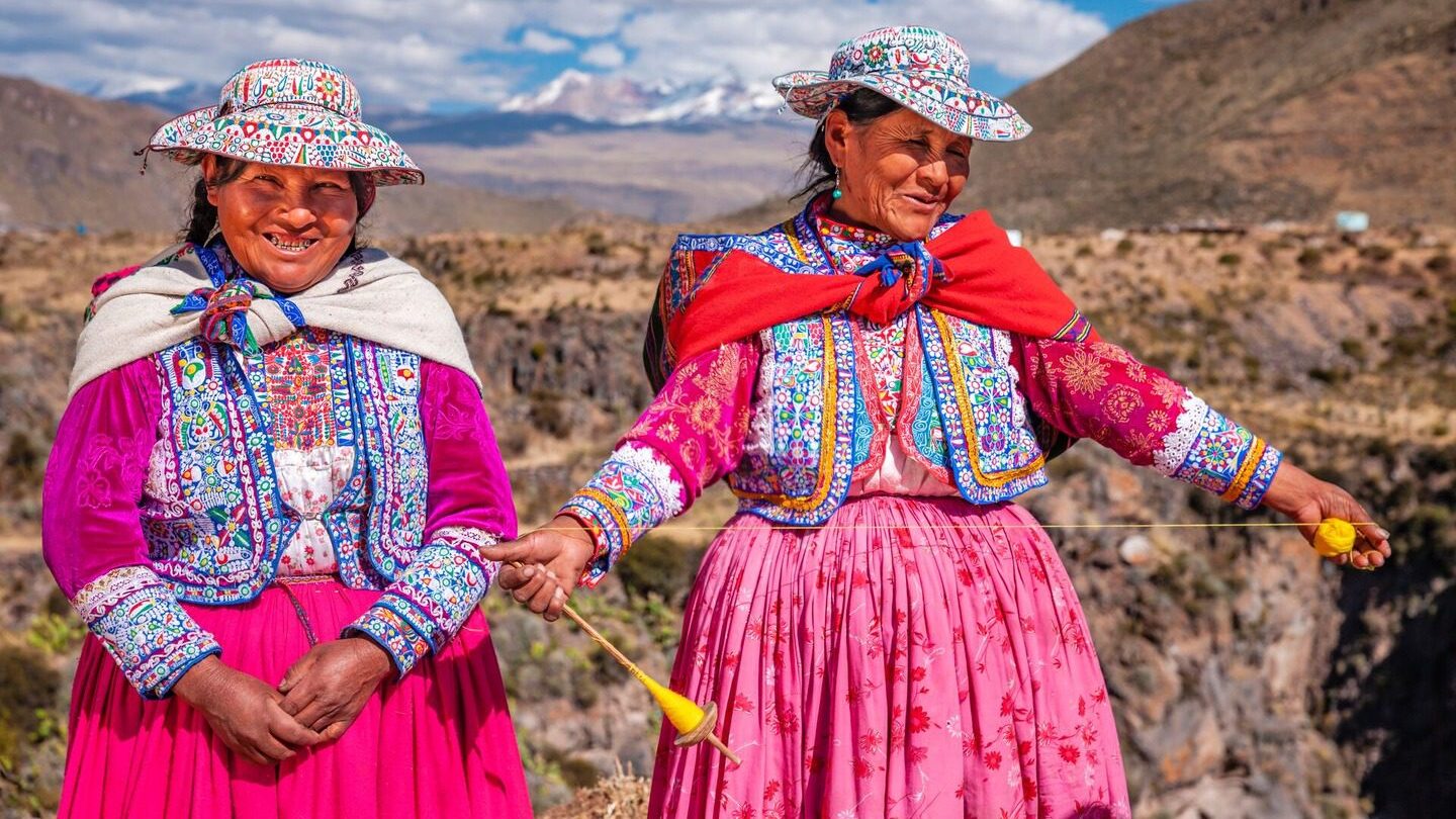 Women demonstrating Quechuan weaving in Peru local communities