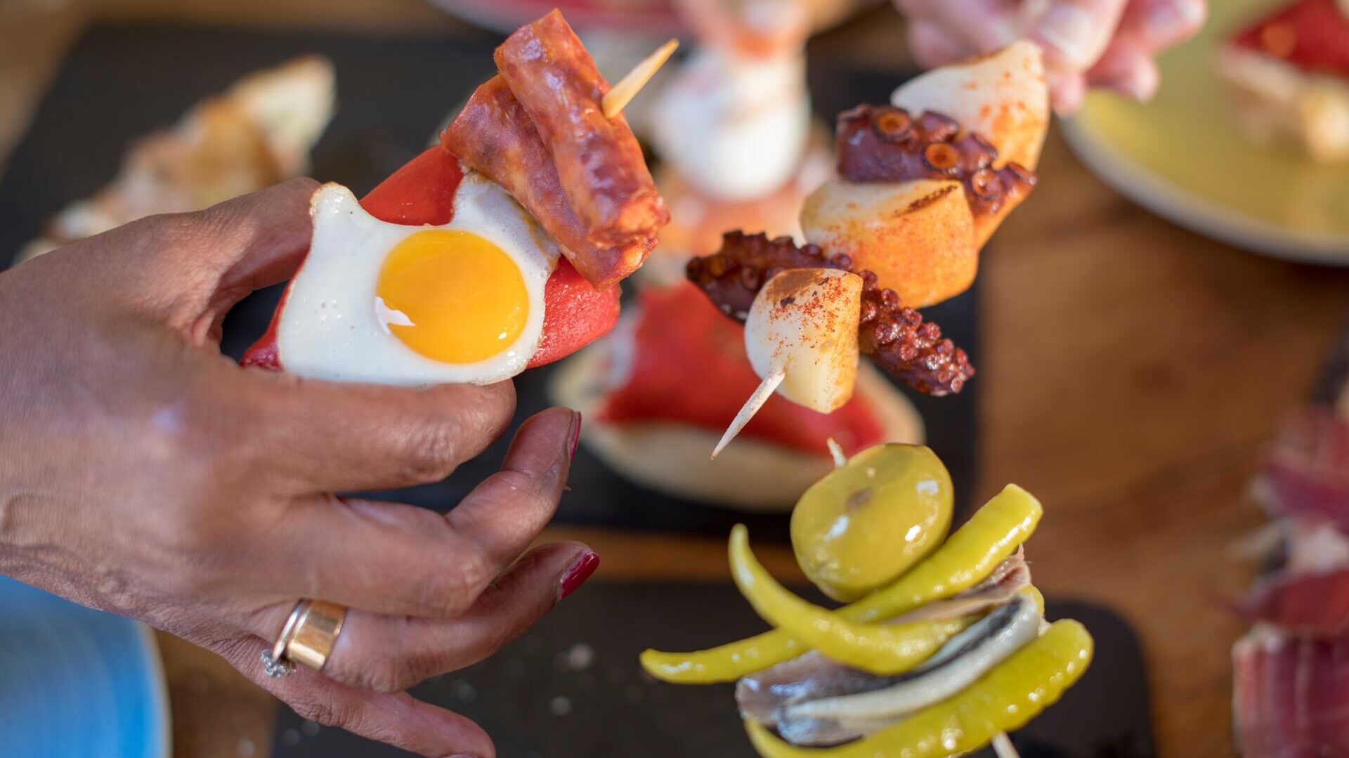 Close up of hands together holding tapas